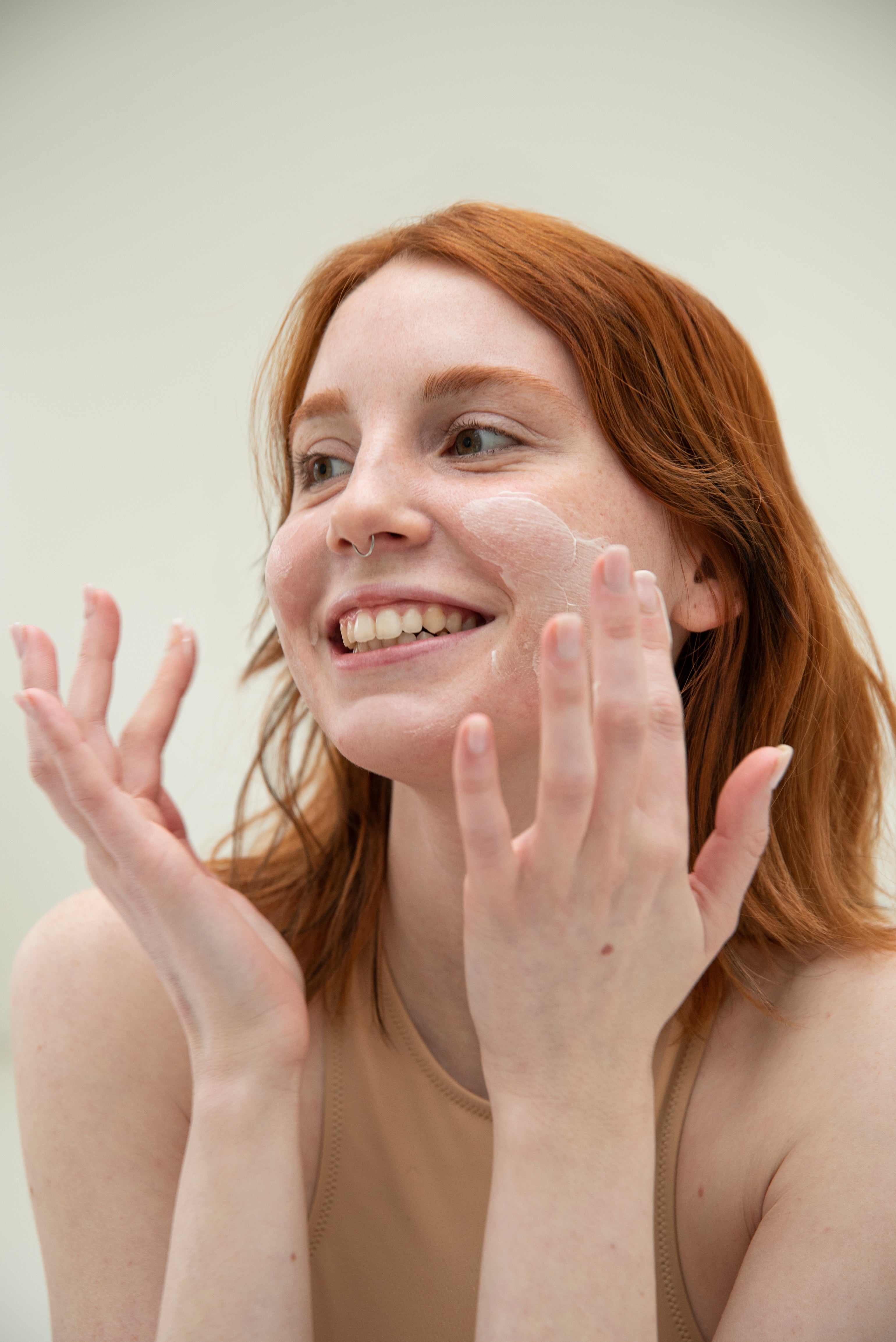 a woman in a bikini brushing her teeth 